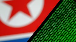 Binary code is seen on a screen against a North Korean flag in this illustration photo November 1, 2017.