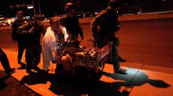 Patrick Carnes is evacuated in a Walmart cart by SWAT medics from the scene of a shooting at a Walmart where Carnes was shopping in Thornton, Colorado.