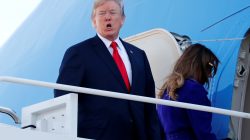 U.S. President Donald Trump shouts to reporters as he and and first lady Melania Trump board Air Force One for travel to Hawaii, on his way to an extended trip to five countries in Asia, from Joint Base Andrews, Maryland, U.S. November 3, 2017.