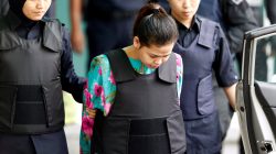 Indonesian Siti Aisyah who is on trial for the killing of Kim Jong Nam, the estranged half-brother of North Korea's leader, is escorted as she leaves at the Department of Chemistry in Petaling Jaya, near Kuala Lumpur, Malaysia
