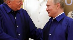 U.S. President Donald Trump and Russian President Vladimir Putin shake hands as they take part in a family photo at the APEC summit in Danang, Vietnam November 10, 2017.