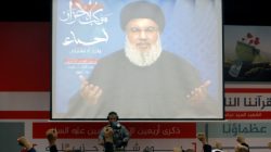 Lebanon's Hezbollah leader Sayyed Hassan Nasrallah is seen on a video screen as he addresses his supporters in Beirut, Lebanon November 10,