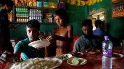 Azimul Hasan, 10, a Rohingya refugee boy, serves plates at a roadside hotel where he works at Jamtoli, close to Palong Khali camp, near Cox's Bazar, Bangladesh, November 12, 2017.