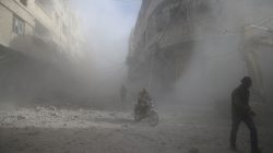 People are seen during shelling in the town of Hamoria, eastern Ghouta in Damascus, Syria, December 3,