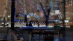 News of the Dow Jones Industrial average passing 20,000 and Boeing's stock price play on television at a Fidelity Investments office in Cambridge, Massachusetts, U.S., January 25, 2017. REUTERS/Brian Snyder