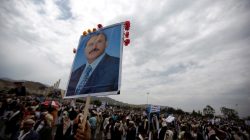 A supporter of Yemen's then President Ali Abdullah Saleh waves a poster featuring him during a rally to show support for him in Sanaa September 9, 2011.