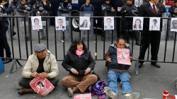 Activists hold a protest against a law that militarises crime fighting in the country outside the Senate in Mexico City, Mexico December 14, 2017. Placards read, "No to the Militarisation in the Country". Picture taken December 14, 2017.