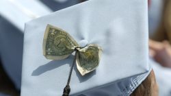 Graduates celebrate receiving a Masters in Business Administration from Columbia University during the year's commencement ceremony in New York in this May 18, 2005 file photo. dreams of many college seniors. REUTERS/Chip East/Files