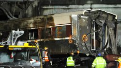 A damaged Amtrak passenger train car is lifted from the tracks at the site of the derailment of Amtrak train 501 in Dupont, Washington, U.S., December 19, 2017.