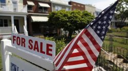 A U.S. flag decorates a for-sale sign at a home in the Capitol Hill neighborhood of Washington, August 21, 2012.