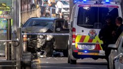Australian police stand near a crashed vehicle after they arrested the driver of a vehicle that had ploughed into pedestrians at a crowded intersection near the Flinders Street train station in central Melbourne, Australia December 21, 2017.
