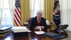 U.S. President Donald Trump sits at his desk before signing tax overhaul legislation in the Oval Office of the White House in Washington, U.S., December 22, 2017.
