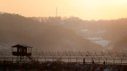 South Korean soldiers patrol along a barbed-wire fence near the militarized zone separating the two Koreas, in Paju, South Korea, December 21, 2017