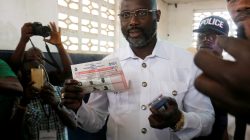 George Weah, former soccer player and presidential candidate of Congress for Democratic Change (CDC), prepares his ballot during presidential elections at a polling station in Monrovia, Liberia, December 26, 2017.
