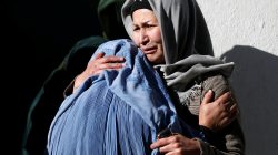 Afghan women mourn inside a hospital compound after a suicide attack in Kabul, Afghanistan December 28, 2017.