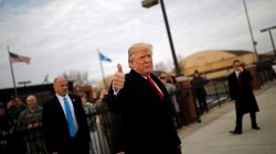 U.S. President Donald Trump gives a thumbs-up to reporters as he boards Air Force One for travel to Palm Beach from Joint Base Andrews, Maryland, U.S., December 22, 2017