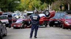 Chicago Police officers investigate a crime scene after a motorist was shot in the head and lost control of his vehicle along the 5300 block of west Monroe Street in Chicago, Illinois, U.S., October 31, 2017. The driver later died in the hospital, according to the police.