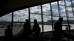 People are seen in silhouette inside the Trans World Airlines Flight Center at John F. Kennedy Airport in the Queens borough of New York, October 18, 2015.