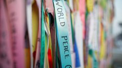Ribbons bearing messages wishing for unification between the two Koreas hang on a barbed-wire fence near the militarized zone separating the two Koreas, in Paju, South Korea, December 21, 2017.
