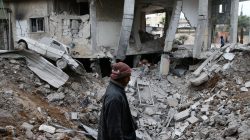 A man is seen near rubble of damaged buildings after an airstrike on the Eastern Ghouta town of Misraba, Syria, January 4, 2018.