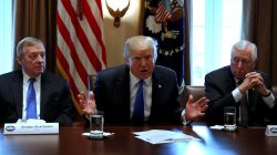 U.S. President Donald Trump, flanked by U.S. Senator Dick Durbin (D-IL) and Representative Steny Hoyer (D-MD), holds a bipartisan meeting with legislators on immigration reform at the White House in Washington, U.S. January 9, 2018. REUTERS/Jonathan