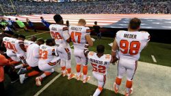 Some members of the Cleveland Browns team kneel, while others stand, during the National Anthem before the start of their game against the Indianapolis Colts at Lucas Oil Stadium in Indianapolis, U.S., September 24, 2017. USA TODAY