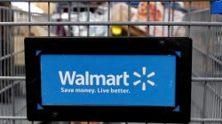 : A customer pushes a shopping cart at a Walmart store in Chicago, Illinois, U.S. November 23, 2016.