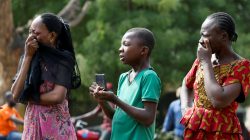 People cry as a truck carries the coffins of people killed by the Fulani herdsmen, in Makurdi, Nigeria January 11, 2018.