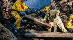 Rescue workers scour through cars for missing persons after a mudslide in Montecito.