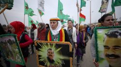 A woman holds a picture of Kurdish leader Abdullah Ocalan of the Kurdistan Workers Party (PKK) during a protest against Turkish attacks on Afrin, in Hasaka province, Syria, January 18, 2018.