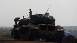 Turkish soldiers stand on tanks in a village on the Turkish-Syrian border in Gaziantep province, Turkey January 22, 2018.