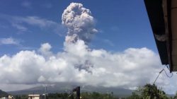 An ash cloud hovers over the Mayon volcano, as seen from the Bicol Region, Philippines, in this still image taken from a January 21,2018 social media video. Randall Matthew Lorayes via REUTERS