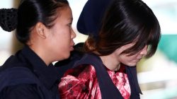 Vietnamese Doan Thi Huong, who is on trial for the killing of Kim Jong Nam, the estranged half-brother of North Korea's leader, is escorted as she arrives at the Shah Alam High Court on the outskirts of Kuala Lumpur, Malaysia January 22, 2018.