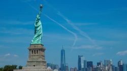 People visit the Liberty State Island as Lower Manhattan is seen at the background in New York, U.S., August 17, 2017.
