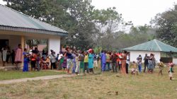 A still image taken from a video shot on December 9, 2017 shows Cameroonian refugees standing outside a center in Agbokim Waterfalls village, which borders on Cameroon, Nigeria.
