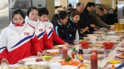 North and South Korea women's ice hockey athletes stand in a line at a dining hall at the Jincheon National Training Centre in Jincheon, South Korea January 25, 2018