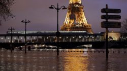 A view shows the flooded banks of the Seine River and the Eiffel Tower.