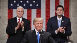 U.S. President Donald J. Trump (C) stands at the podium as U.S. Vice President Mike Pence (L) and Speaker of the House U.S. Rep. Paul Ryan (R-WI) (R) look on during his first State of the Union address to a joint session of Congress inside the House Chamber on Capitol Hill in Washington, U.S., January 30, 2018.