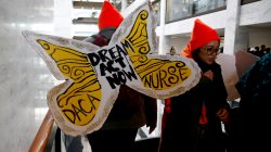 Protesters calling for an immigration bill addressing the so-called Dreamers, young adults who were brought to the United States as children, walk through the Hart Office Building on Capitol Hill in Washington, U.S., January 16, 2018.