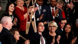 North Korean defector Ji Seong-ho, currently a law student at Dongguk University, holds up his crutches during U.S. President Donald Trump's State of the Union address to a joint session of the U.S. Congress on Capitol Hill in Washington, U.S. January 30, 2018.