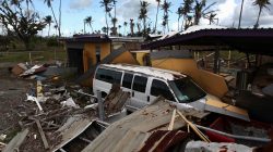 A car is partially buried under the remains of a building, after Hurricane Maria hit the island in September, in Humacao, Puerto Rico January 25, 2018.