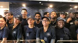 Newly hired employees take a break from training to pose for a group photo at the chain’s soon-to-open 54th outlet in Oakland, California ,U.S., January 24, 2018.