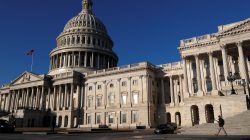 People walk by the U.S. Capitol building in Washington, U.S., February 8, 2018.