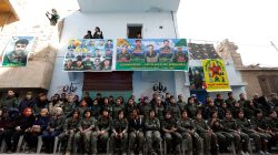 Kurdish female fighters of the Women's Protection Unit (YPJ) hold their weapons as they sit in the Sheikh Maksoud neighbourhood of Aleppo, Syria February 7, 2018. Picture taken February 7, 2018.