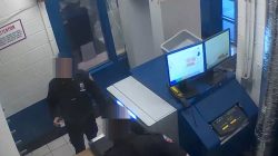 An undercover investigator with New York City's Department of Investigation (DOI) posing as a corrections officer passes through front gate security as part of an operation against smuggling at city jails, in an undated still image from video released in New York City, New York, U.S. February 8, 2018. Parts of the image are blurred at source. New York City Department of Investigation/