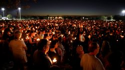 People attend a candlelight vigil for victims of the shooting at nearby Marjory Stoneman Douglas High School, in Parkland, Florida, February 15, 2018. REUTERS/Carlos Garcia Rawlins