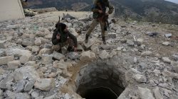 Turkish-backed Free Syrian Army fighter stands on rubble in Northern Afrin countryside, Syria, February 16, 2018. REUTERS/Khalil Ashaw