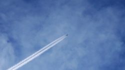 A helicopter is seen flying over the besieged town of Douma, Eastern Ghouta, Damascus, Syria February 20, 2018. REUTERS/Bassam Khabieh