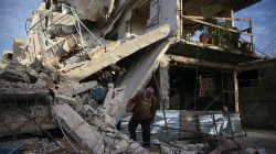 A person inspects damaged building in the besieged town of Douma, Eastern Ghouta, Damascus, Syria February 20, 2018. REUTERS/Bassam Khabieh