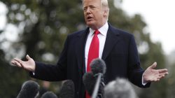 U.S. President Donald Trump takes questions from to reporters before departing the White House to speak at CPAC in Washington, U.S., February 23, 2018. REUTERS/Jim Bour